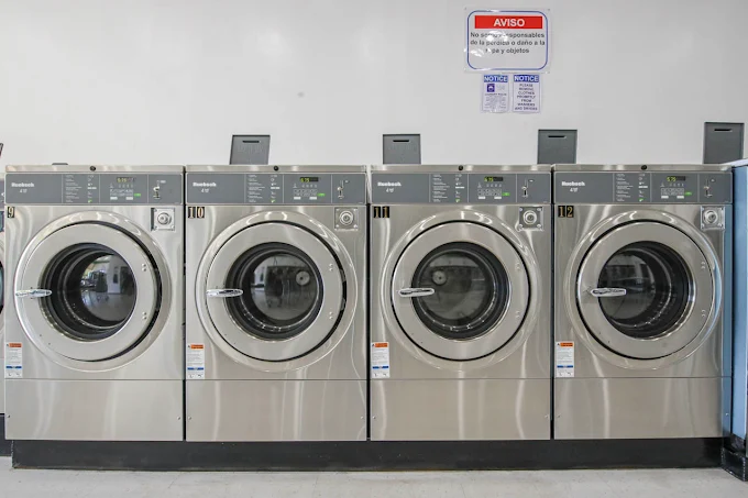 Row of stainless Huebsch washers